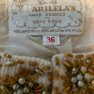 Beautiful Lamb’s Wool and Angora Sweater. All decorations are hand sewn.